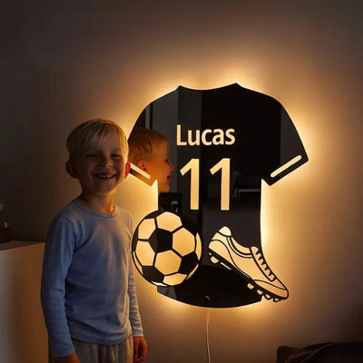 Personalized LED mirror jersey glowing warm white on a boy's bedroom wall