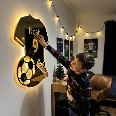 Boy switching on his name and number mirror jersey light