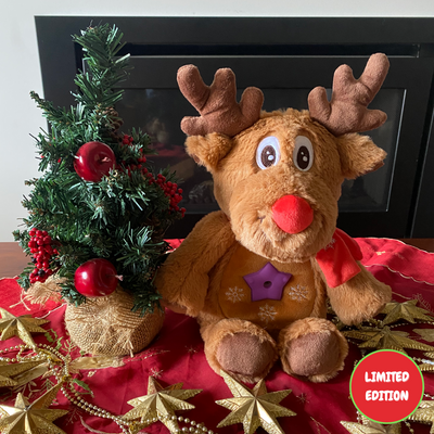 Reindeer Glow Buddy by the Christmas tree